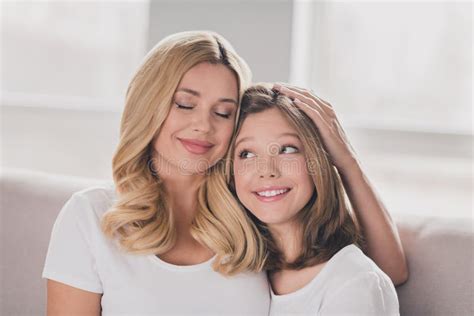 Photo Of Charming Adorable Mommy Daughter Wear White T Shirts Smiling Hugging Sitting Couch