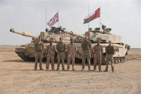 A British Tank Crew Of The Royal Tank Regiment Stands Next To Royal