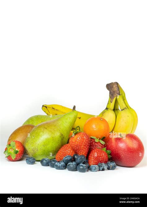 Vertical Shot Of Fresh Fruits Isolated On A White Background Stock