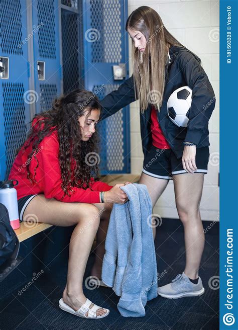 Two Soccer Teammates In A Locker Room Console Each Other After A Loss