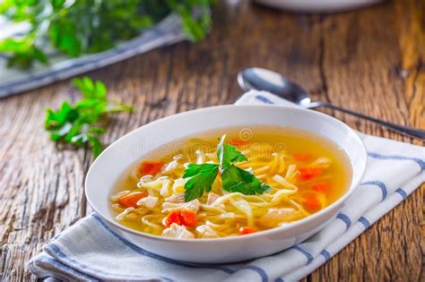 Chicken Broth Bone Broth With Noodles Carrot And Parsley In White Bowl Stock Image Image Of