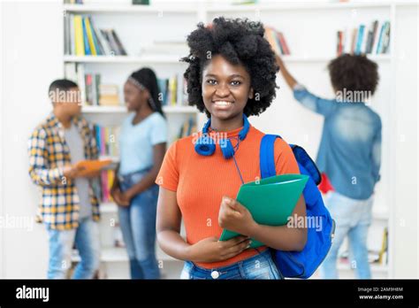 Beautiful African American Female Student With Group Of Students At