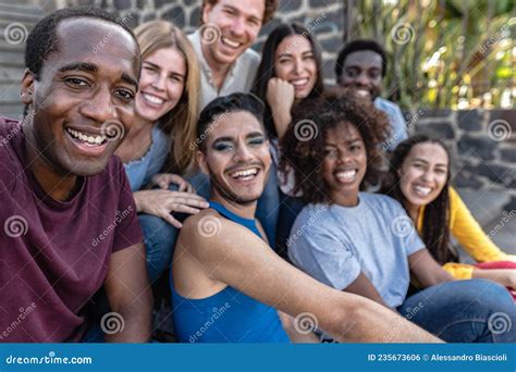 Young Multiracial Group Of Friends Taking Selfie Sitting On Urban