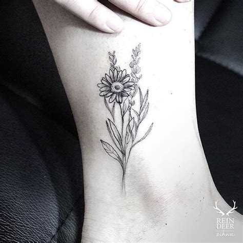 The flowers are abundant in thick petals and the whole tattoo looks rich in details. Reindeer Ink on Instagram: "스케치 느낌으로" | Daisy flower tattoos, Sunflower tattoo small, Small ...