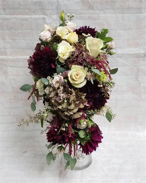 Cascade wedding bouquets with burgundy. Cascade wedding bouquet with antique fall colors. Flowers ...