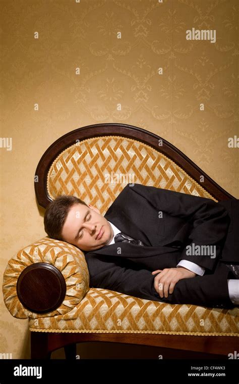 Businessman In Suit Sleeping On Sofa In Room Stock Photo Alamy