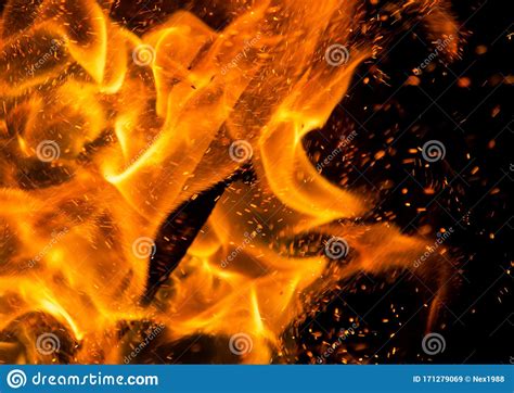 Flame Of Fire With Sparks On A Black Background Stock Image Image Of