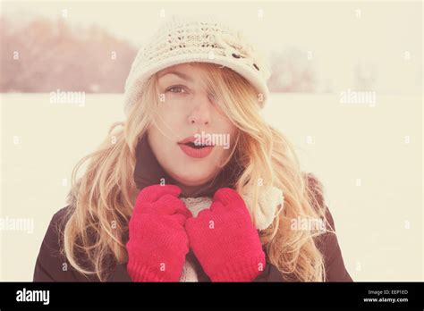 Winter Woman In Snow Photo Looking And Blows Breath At Camera Outside