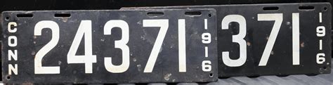 Bonhams Cars : Two pairs of antique license plates,