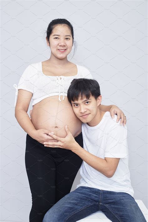 Portrait Of A Happy Pregnant Wife With Her Husband Background Stock
