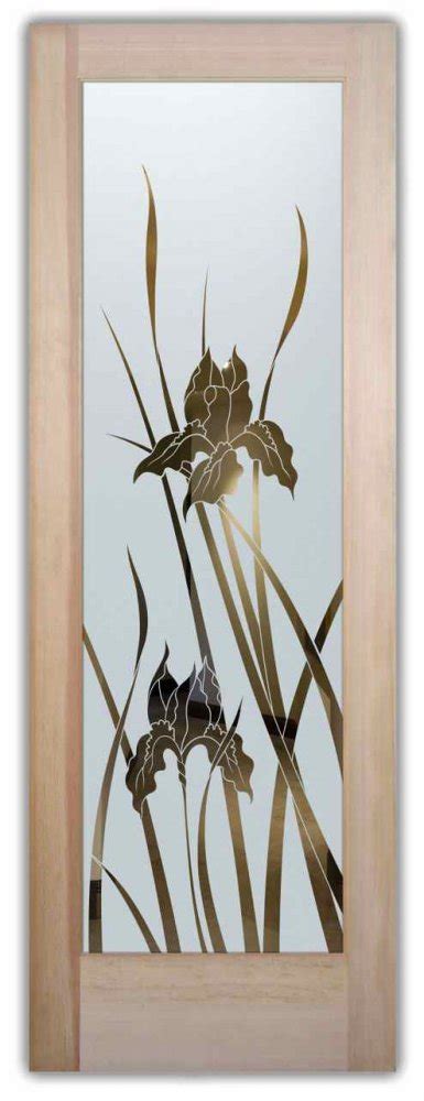 Water features, flower planters and palm trees make this home looks like a party and we're only on the front door step. glass front doors etched glass iris flower Negative