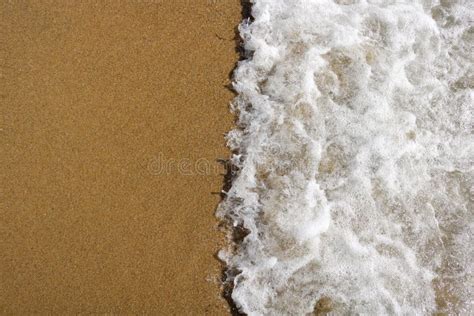 Soft Wave Of Turquoise Sea Water On The Sandy Beach Stock Photo