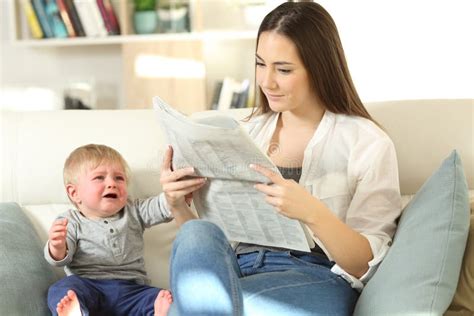 Baby Demanding Attention And Mother Ignoring Him Stock Photo Image Of