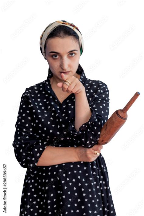 Angry Wife Waiting For Her Husband Aggressive Young Middle Eastern Woman Holding Dough Rolling
