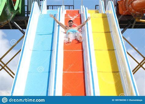 Man On Slide At Water Park Summer Stock Photo Image Of Blue