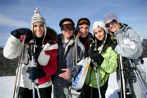 Group Of Friends With Skis Stock Image Colourbox