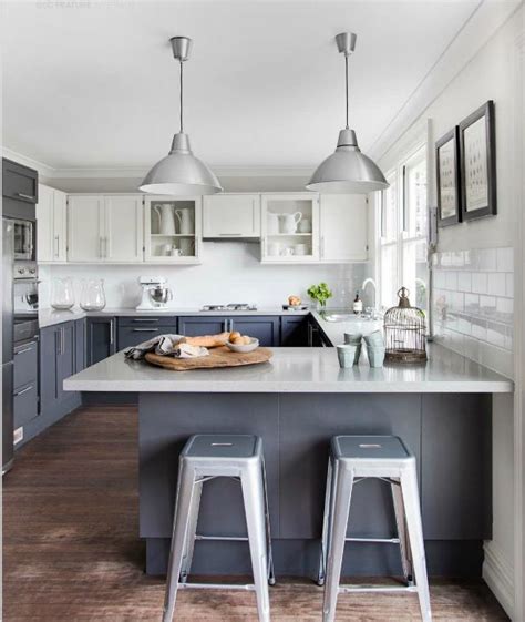 With the kitchen now opening up into the frontroom and all of the soffits. YES - gray base cabinets & white uppers, probably softer ...