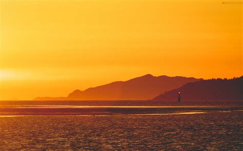 1920x1200 Yellow Sunset Near Lighthouse 1200p Wallpaper Hd Nature 4k