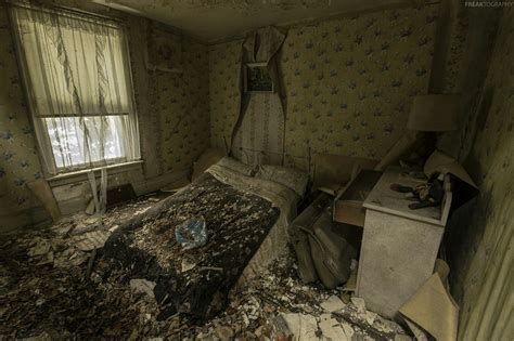 An Abandoned Bedroom That Appears To Be Crumbling In On Itself