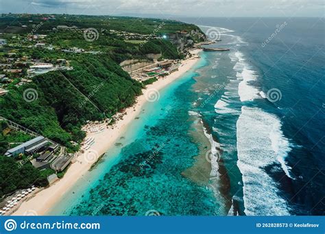 Aerial View Of Popular Bali Beach With Turquoise Ocean And Waves In
