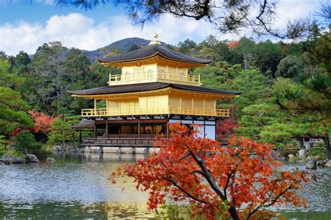 Premium Photo Golden Pavilion At Kinkakuji Temple With Red Leaves In