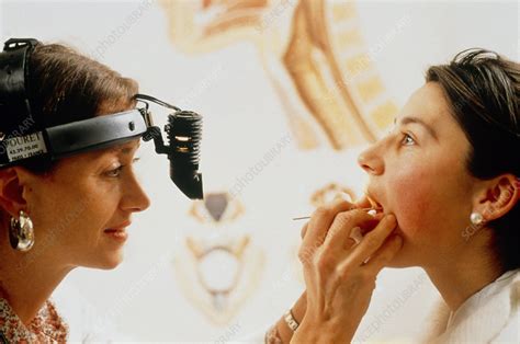 Doctor Examining A Womans Throat Stock Image M9200635 Science