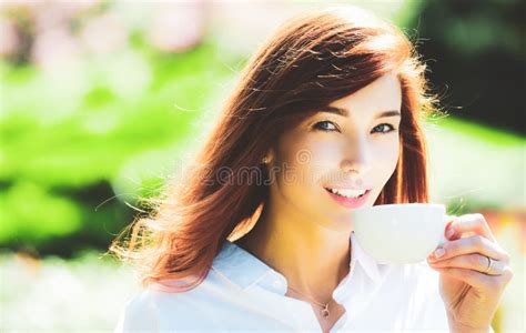 Outdoor Portrait Of Young Beautiful Happy Smiling Lady Wit Cup Coffee