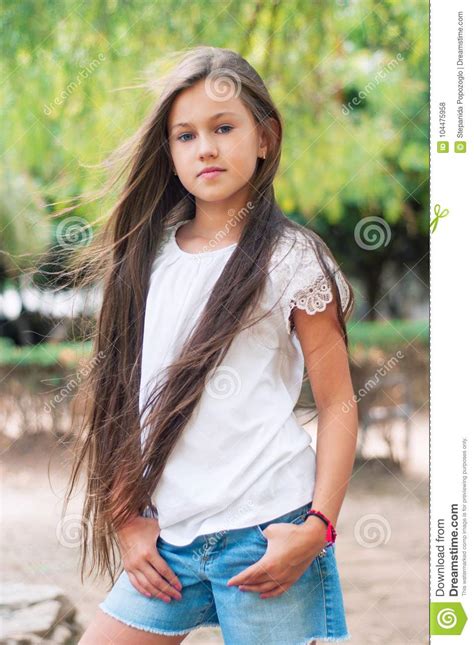Beautiful School Girl With Long Hair In The Park Prety