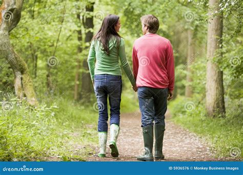 Couple Walking On Path Holding Hands Royalty Free Stock Image Image