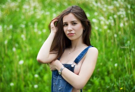 Cute Brunette In Denim Dungarees Outdoors Cheeky Photos