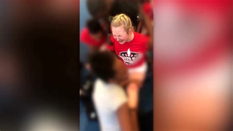 video cheerleader forced to do split despite pleas to stop youtube