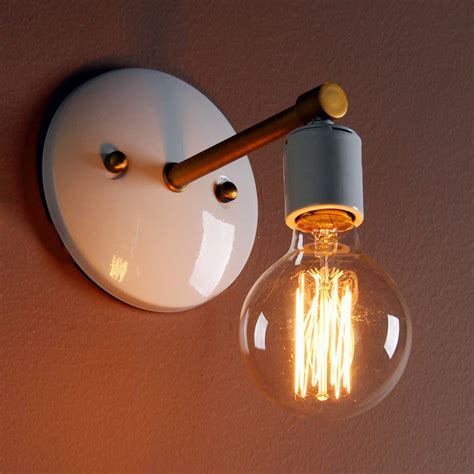 The clean, airy cage design of this geometric open frame ceiling light fixture is constructed without glass. Minimalist Wall Light By Unique's Co. | notonthehighstreet.com