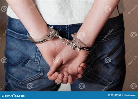 Handcuffed Young Man In The Sofa Royalty Free Stock Image