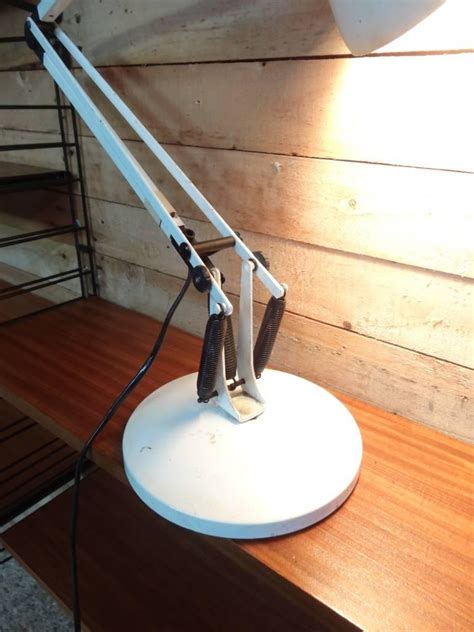 This cool retro lamp has an aged factory finish, articulated arm design. White Anglepoise Lamp Designed by George Carwardine for ...