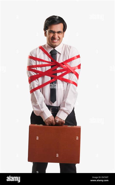 Businessman Tied Up With Red Ribbon Stock Photo Alamy