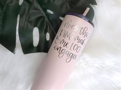 Makes a great bridal shower gift, bachelorette party gift, or a just because gift! Tumbler that says Does This Ring Make Me Look Engaged ...