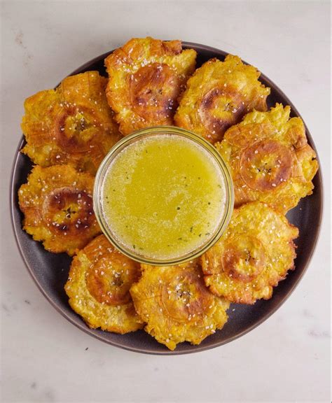 Crispy Tostones With Garlic Dipping Sauce Plantain Recipes Colombian Food Food