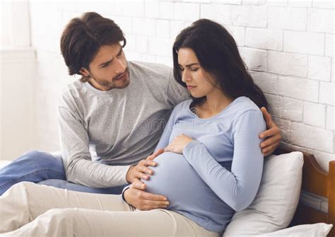 Worried Husband Calling Doctor For His Pregnant Wife Having Contractions Stock Image Image Of