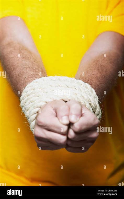 Man Hands Tied Rope High Resolution Stock Photography And Images Alamy
