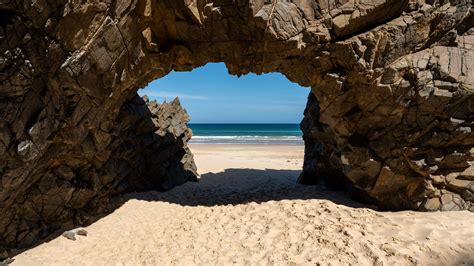 Download Wallpaper 3840x2160 Rock Beach Sand Sea Shadow Nature 4k