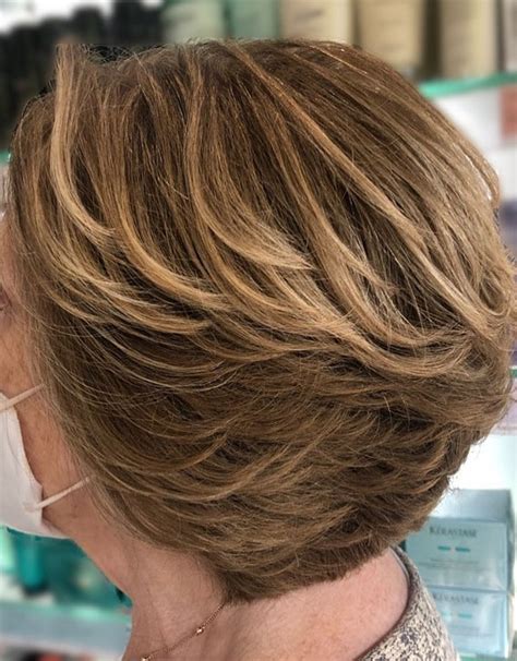 20 layered hairstyles for women over 50 feed inspiration reverasite