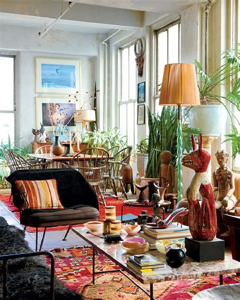 A Living Room Filled With Lots Of Furniture And Plants On Top Of Its Walls