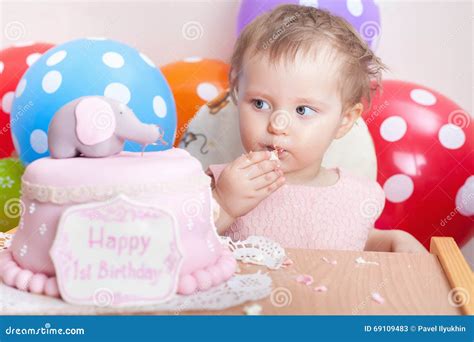 Funny Baby Celebrating First Birthday And Eating Cake Stock Image
