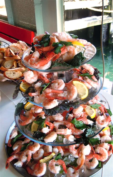 Remove shrimp from the pot with a slotted spoon or spider into the bowl of ice. Shrimp Cocktail Tower | Seafood platter, Shrimp cocktail ...