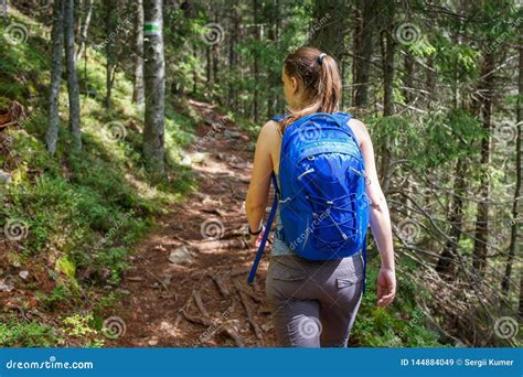 Young Smiling Woman With Backpack Hiking In Forest Stock Image Image