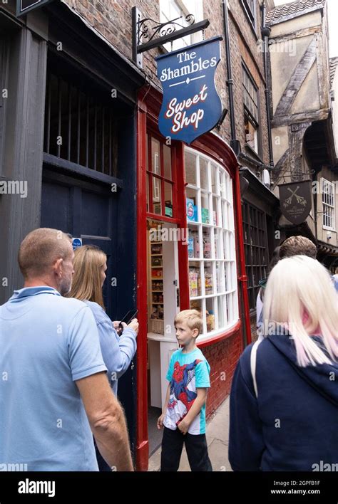 People With Children At The Shambles Sweet Shop The Shambles York Uk