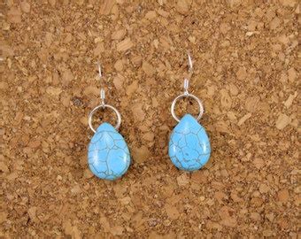 Turquoise Howlite Drop Earrings Wrapped In Bronze