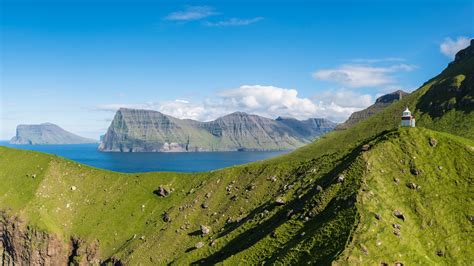 View Of Kalsoy Island And Its Lightouse At Sunset Faroe Islands