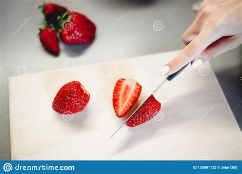 Strawberries On A Cutting Board With A Knife Stock Photo Image Of