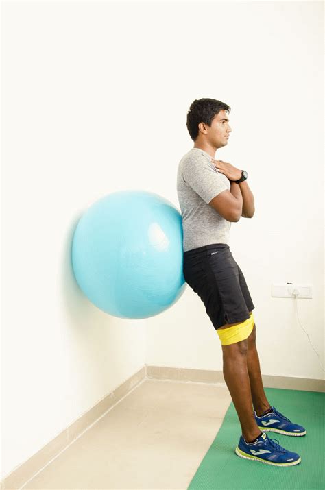Wall Squat With Medicine Ball Between Knees